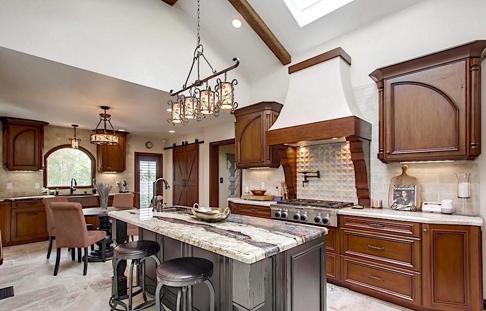 Knotty alder cabinets, columns on uppers, and recessed panel doors