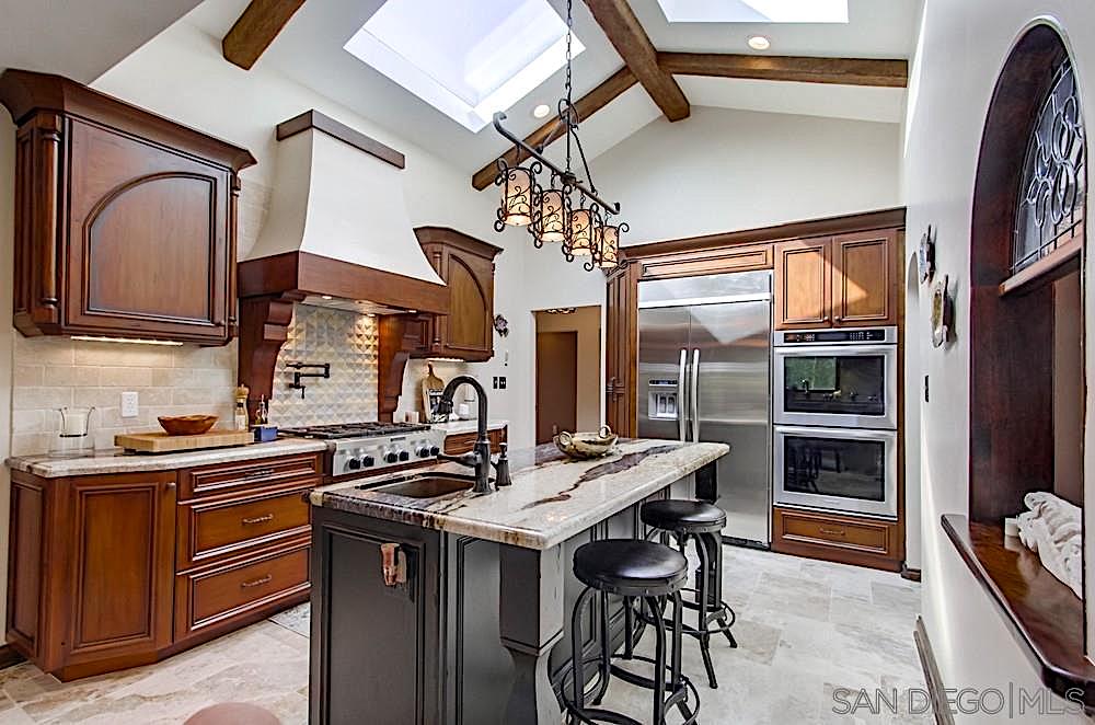 Knotty alder cabinets, island with column corners