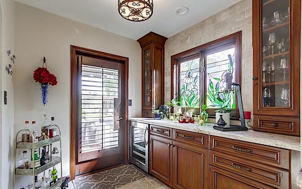 Floor-to ceiling glassware cabinets with glass doors and drawers for specialty wine tools